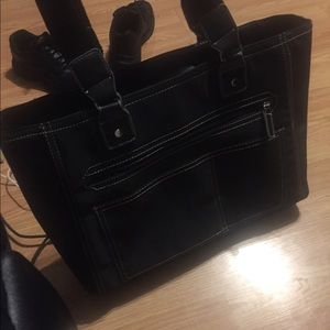 Black purse with pink interior